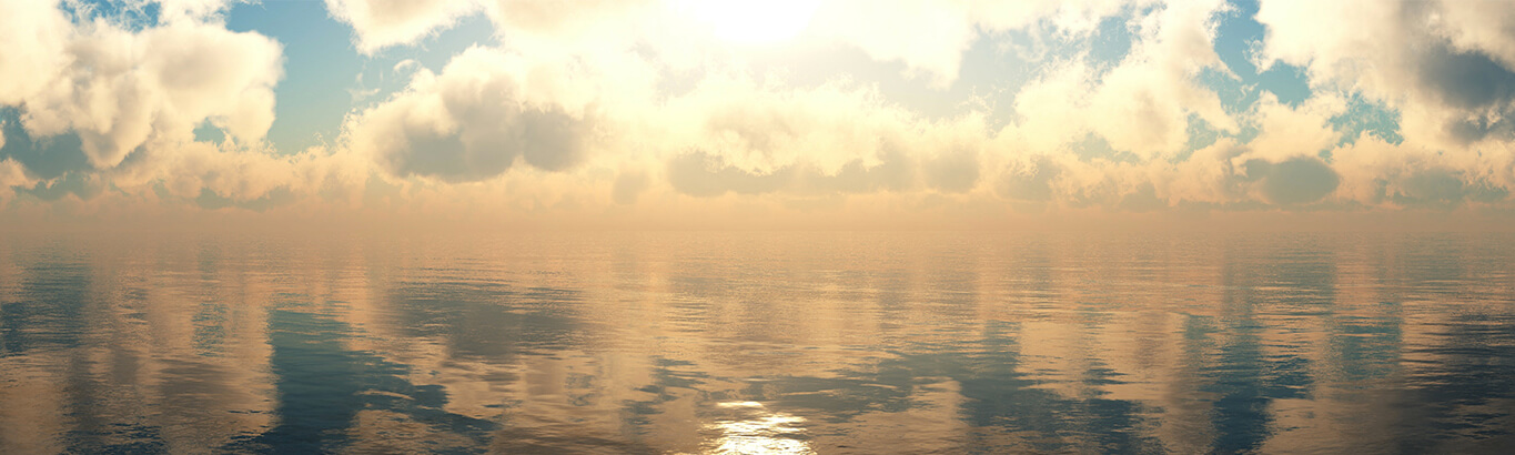 Water reflects clouds and sunlight on its surface.